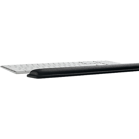 A black wrist rest rests in front of a white keyboard.
