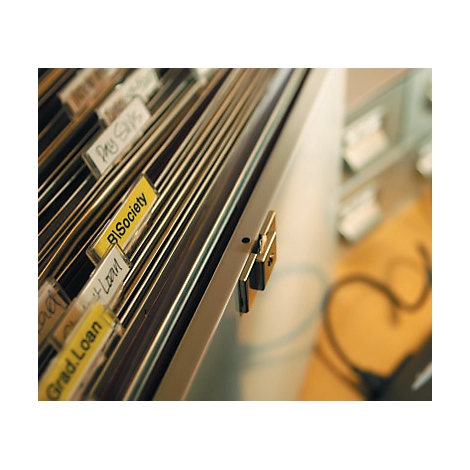 Close-up of a filing cabinet with labeled file cards. Yellow file cards with labels. Metallic holder.