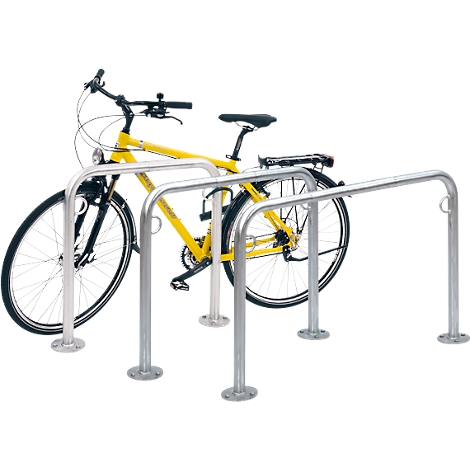 Yellow bicycle in a silver bike rack. The rack has a U-shape.