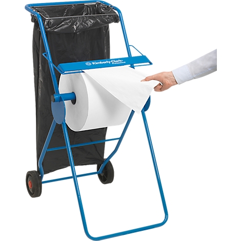 Blaues Reinigungswagen mit Papierrolle und Müllbeutel. Jemand nimmt Papier von der Rolle. Aufschrift: Kimberly-Clark.