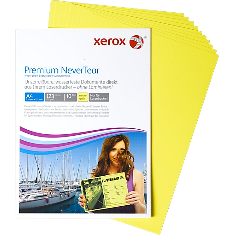 A stack of yellow paper sheets lies next to a white sheet that says "Xerox Premium Never Tear". A woman holds a yellow sign that says "For sale".