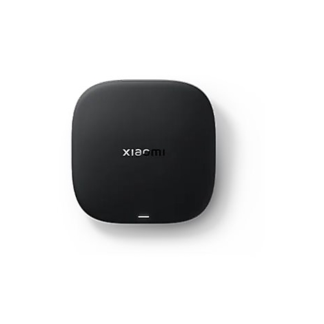 Schwarze, quadratische Xiaomi TV-Box mit abgerundeten Ecken und einer kleinen Status-LED auf weißem Hintergrund.