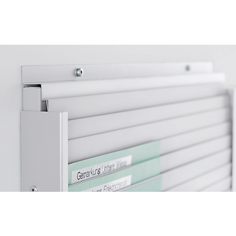 White wall shelf with labeled files. Light gray, clean lines, text: Gemarkung Untere Wiese.