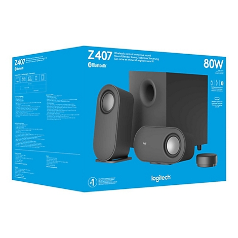 Schwarzes Logitech Z407 2.1-Lautsprechersystem mit Subwoofer, zwei Satelliten und Fernbedienung auf blauem Hintergrund.