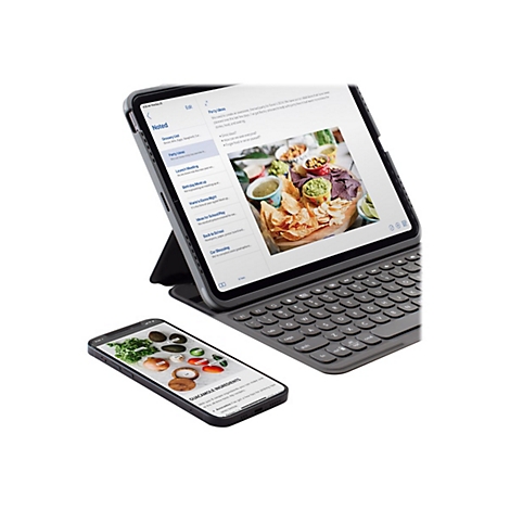 Ein iPad mit Tastatur und ein Smartphone zeigen Notizen und Guacamole-Zutaten. Auf dem iPad ist eine Party-Planung zu sehen.
