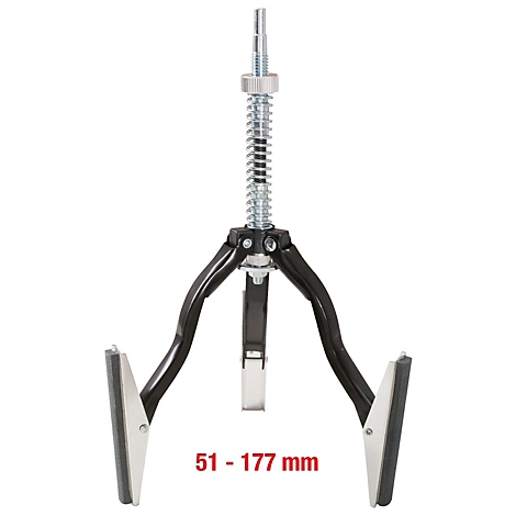 Kolbenring-Spannzange. Schwarz-silbernes Werkzeug mit federbelastetem Mittelteil und drei Armen mit Spannbacken.