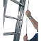 Close-up of an aluminum ladder with a black cord being held by a hand. A white background is in the background.