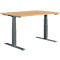 An adjustable height desk with wooden top and grey frame.