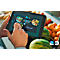 Hands holding tablet with menu app, menu displays "Specials" with images of dishes, watermelon, oranges in background.