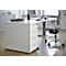 White office desk with four drawers. An office chair is next to it.
