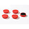 Five red, round containers. One open with black contents, the others with lids. A logo on each.