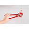 Hand holding red pliers working on a dowel on a white wall.
