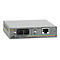 Convertisseur de médias Ethernet gris avec divers ports et indicateurs. Inscription: Allied Telesyn AT-MC102XL.