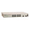 Hellgrauer Allied Telesyn Netzwerk-Switch AT-GS950/16 mit 16 Ports vor weißem Hintergrund.
