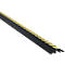 Black cable bridge element with yellow stripes, diagonal view.