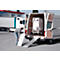 A man is positioning a ramp on a van. A rolling crate is inside the van.