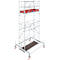 A scaffold with red tray, platform, and wheels. The scaffolding stands on wheels and has several levels.