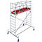 Metal scaffolding with a red shelf and blue rollers.