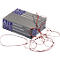 Caja gris con gomas elásticas rojas al lado, inscripción ALCO, gomas elásticas y otros idiomas.