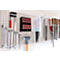 Pegboard with tools, such as wrenches, hammer, files, and batteries.