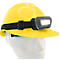 Yellow construction helmet with headlamp. Black band holds the lamp. The light shines brightly.