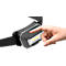 Close-up of a headlamp, a finger is pressing the button.