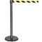 A gray stanchion with a yellow and black striped barrier tape extending to the side.