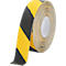Rolled anti-slip tape roll. Yellow and black pattern. Paper roll with white inner core. Good adhesion.