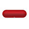 Haut-parleur rouge et oblong avec une façade perforée et des commandes sur le dessus. Le logo Beats est visible.
