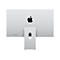Rückseite eines silbernen Apple iMac mit markantem Logo vor neutralem Hintergrund.