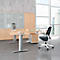 Office with wooden desk, black office chair, cabinets and window with city view.