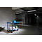 Blue service cart with tools and suitcases in a warehouse.