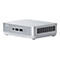 Mini-PC argenté avec logo ASUS, ports USB, bouton d'alimentation et fentes d'aération. Socle blanc.