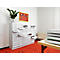 White cabinet with wavy surface, drawers open, room with red carpet. Image with artwork and plants.