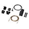 Produkt-Set auf weißem Hintergrund: Mehrere Stecker, Netzteil, Kabel und runde Pads.