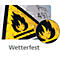 Yellow warning sign with flame symbol, weatherproof. Water droplets are on the image, with an enlarged view.