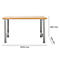 Mesa rectangular marrón claro con patas de metal gris plateado. Dimensiones: 2000 x 700 x 840 mm.