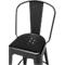 Black metal bar stool, featuring a backrest and a seat with holes.
