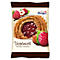 Package of Vogelnestli cookies with raspberry filling, next to raspberries and hazelnut.