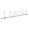 Metal bicycle rack with 7 loops in a row.