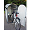 Bicycle parked in a white and gray bicycle garage with the door open.
