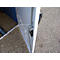 Close-up of a white door with metal hinge, behind it blue elements.
