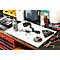 A chain, sprocket, tools, and oil can rest on a table.