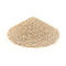 A pile of granular, beige material, possibly sand, against a white background.