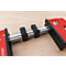 Red clamp with black elements on a wooden surface. The tool is marked with the name "BESSEY".