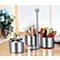 Stainless steel serving set with coffee pods, sugar and pastries. On a table.