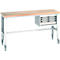Workbench with wooden top, gray steel legs and drawer unit on wheels.