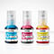 Trois bouteilles d'encre Brother: Bleu, magenta, jaune. Étiquetées avec des lettres et un numéro de volume. Bouchons transparents.
