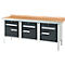 Workbench with wooden top and three drawers. Drawers are black, frame and legs silver.