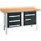 Workbench with wooden top, gray drawers and cabinet doors with silver handles.